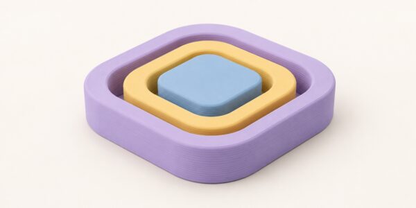 Pastel abstract forms show 3D printing accuracy through an even fit, linking printing tolerance with dimensional accuracy.